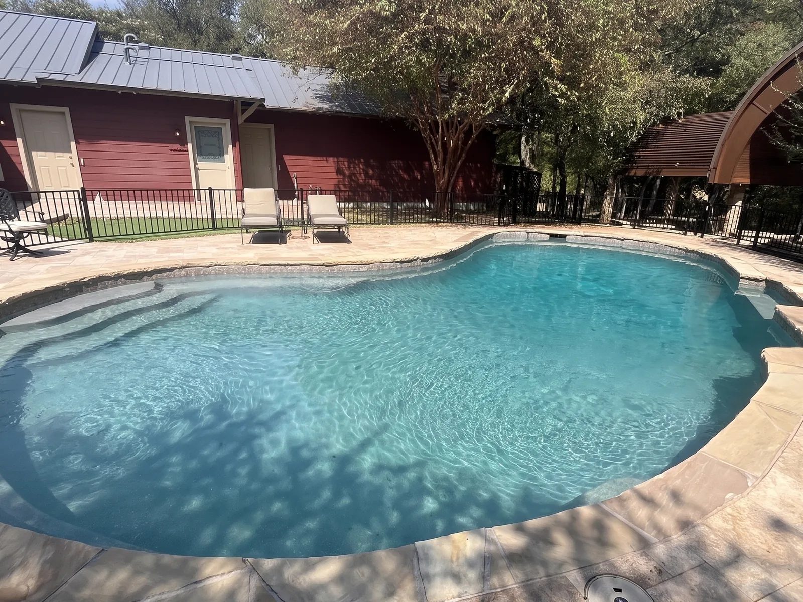 Crystal clear sparkling blue pool after Harrell Brothers service